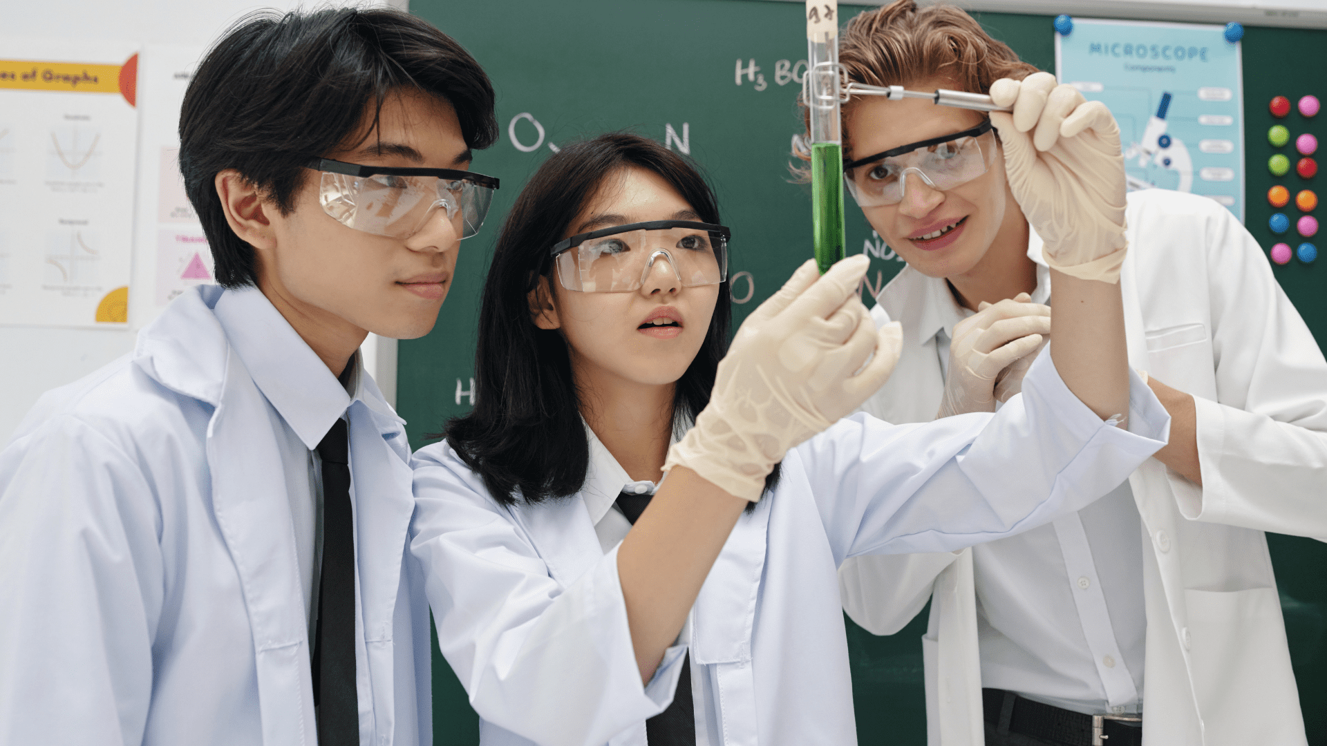 three students in a science class