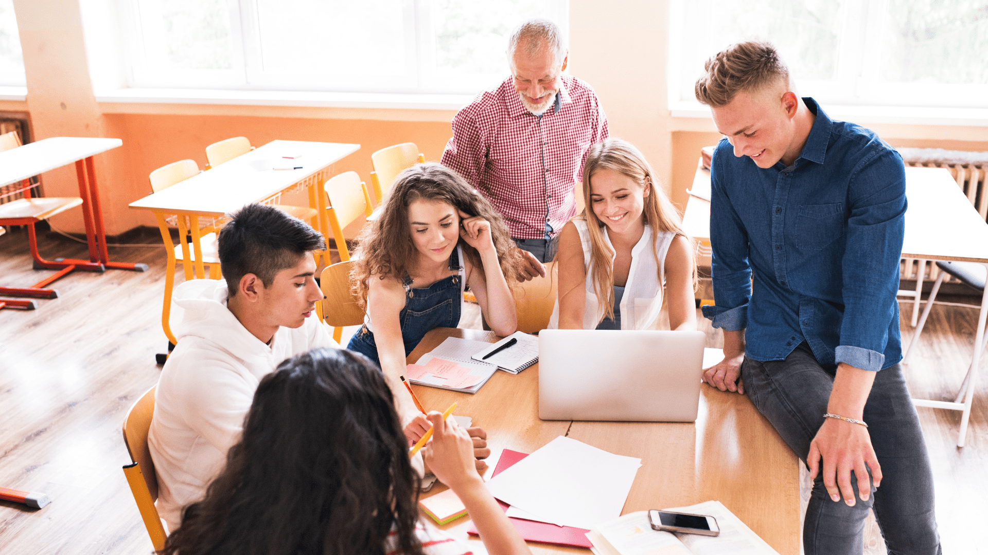 high school students chatting around a table